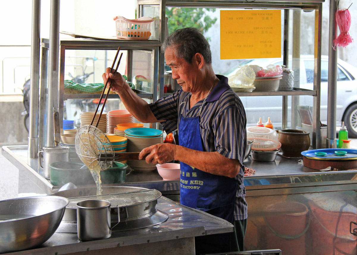 Man preparing noodles in Penang
