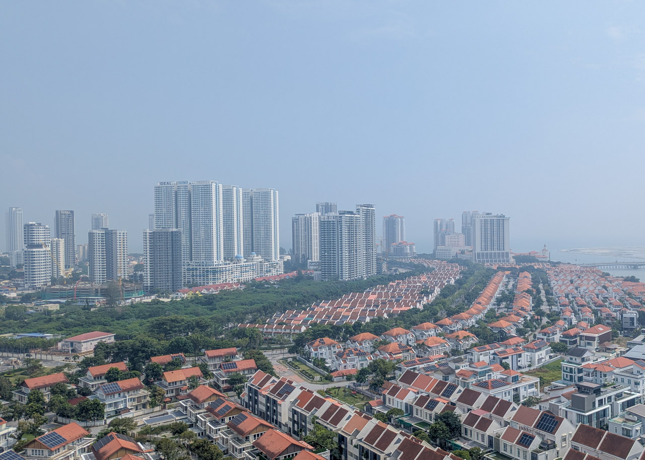 Hazy skies in Penang, August 2026. On clear days you can see the islands in the sea beyond the buildings.